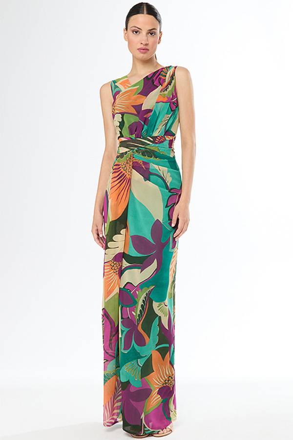 A woman wearing a colorful, floral-patterned sleeveless dress.